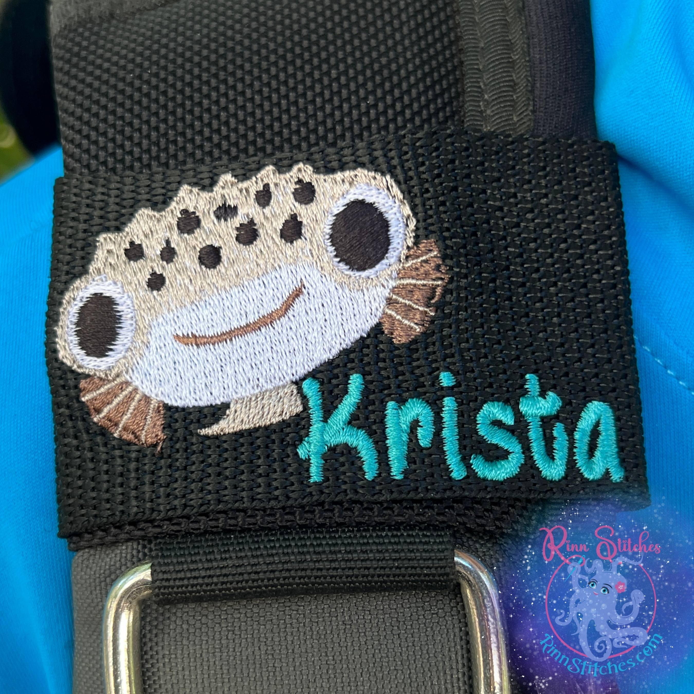 Cute Puffer Fish Face Personalized Scuba Diver BCD Identification Tag Featuring the Name Krista in Teal Thread and Sand Castle Font By Rinn Stitches on Maui, Hawaii
